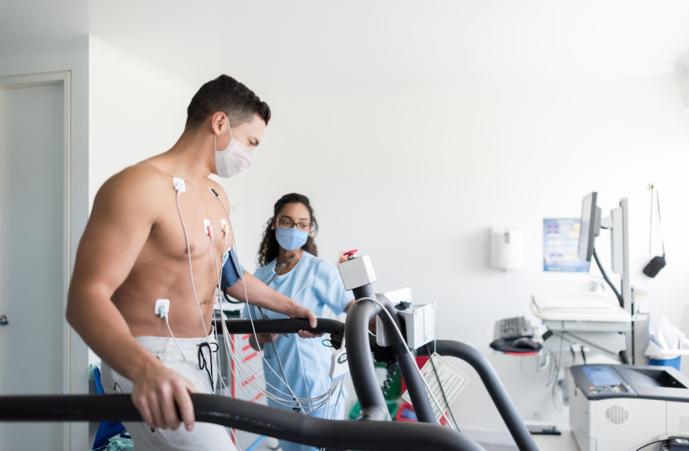 nurse monitoring a patient doing a stress test