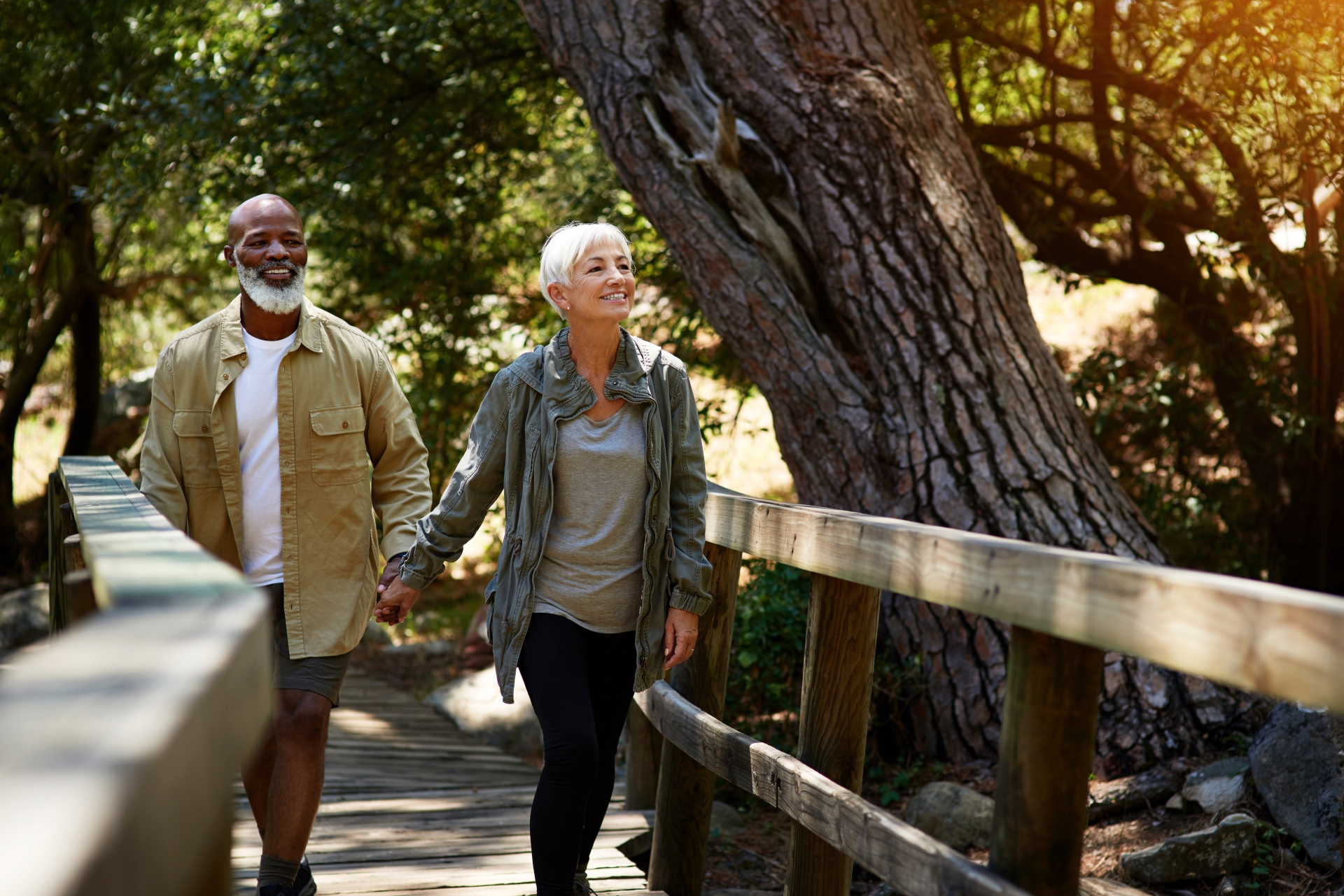 happy senior couple out for a hike on a sunny day