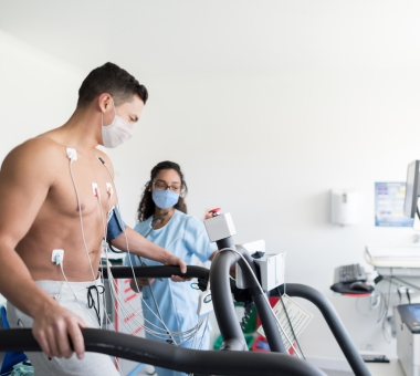 nurse monitoring a patient doing a stress test