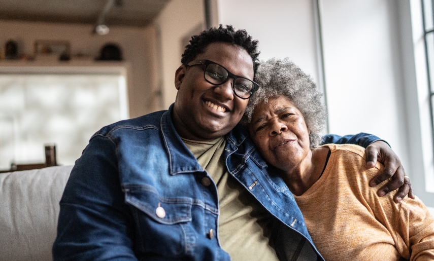 A photo of a smiling mother and son